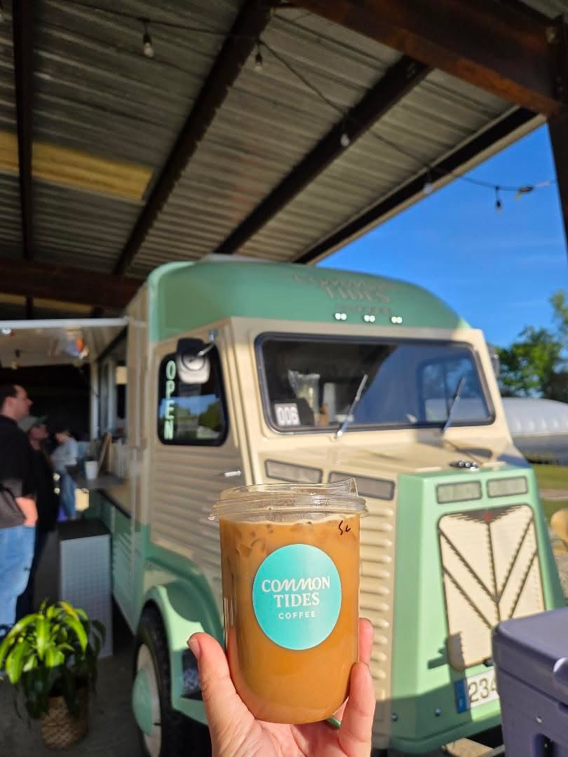 Common Tides vintage coffee trailer with a fresh iced coffee at an Old River Farms event near Wilmington NC