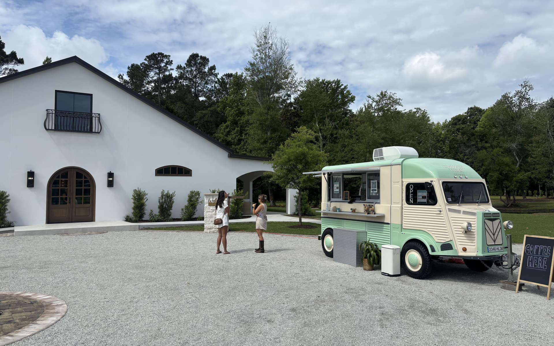 The Common Tides Coffee vintage mobile coffee truck serving guests at an event venue near Wilmington NC